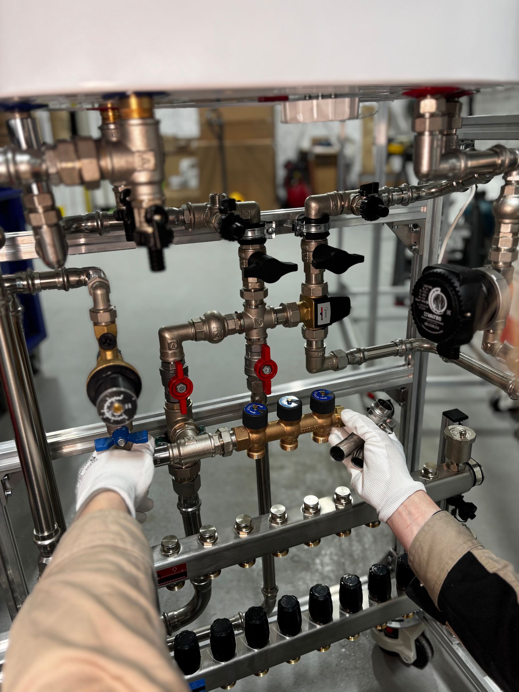 Engineer working on commercial plant room pipework